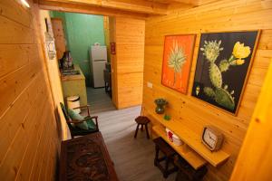 a hallway of a log cabin with a room at Guest House D'Avenida in Vila Praia de Âncora