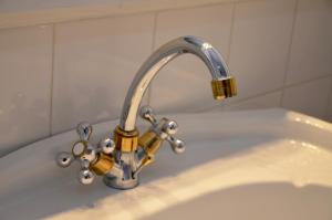 a bathroom sink with a faucet on a tub at Maison de Benedicte in Saint-Brieuc +48 photos