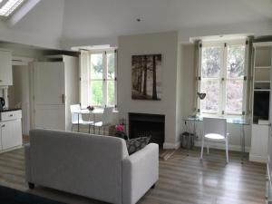 a living room with a couch and a table at Atholanda in Johannesburg