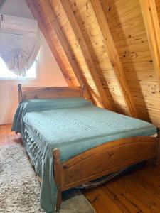 a bed in a room with a wooden ceiling at Salesta San Pedro in San Pedro +48 photos