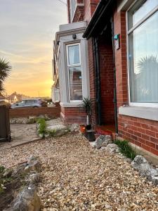 a house with a gravel yard in front of it at The Big One Blackpool in Blackpool