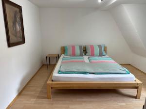 a bed in a small room with at Steinlachquartier in Dußlingen