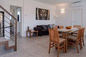 a living room with a table and a couch at Villa Molin Bianco in Arezzo +21 photos