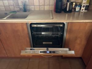 an oven in a kitchen with a counter top at Dream Village Mani in Karvelás +17 photos