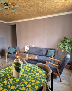 a living room with a couch and a table at Guest House Aspindza in Aspindza