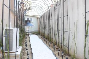 a hallway with plants and a ceiling at RoseBrickHouse in Gwangju