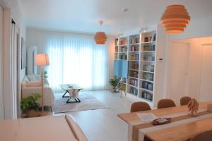 a living room with a table and a dining room at RoseBrickHouse in Gwangju