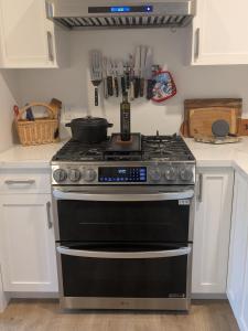 a kitchen with a stove with a pan on it at Casa Dorado - Bright, Sunny 2 Bedroom 1 Bath House - Fenced Yard, Private Patio in Santa Barbara