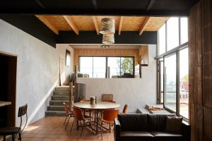 a living room with a table and a couch at Domaine Aari Ona in Aramits
