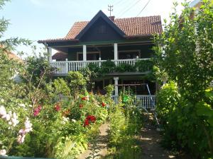 a house with a garden in front of it at Traianov most in Kladovo