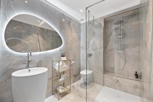 a bathroom with a shower and a sink and a toilet at Hotel San Carlu Citadelle Ajaccio in Ajaccio +30 photos