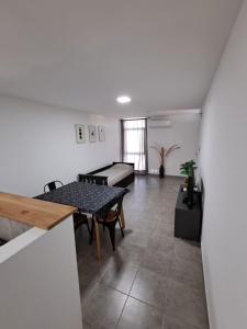 a living room with a table and a couch at Deptosuno in General Roca