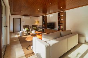 a living room with a couch and a table at Quinta Clara in Vila Verde