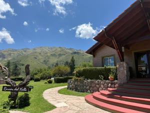 a house with mountains in the background at Rincon del Valle in Merlo