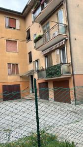 a fence in front of a building at Cozy Best Appartment in Marghera