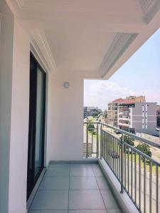 a balcony with a view of a city at Hotel Kyson 凯森酒店 in Cocody