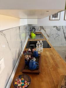 a kitchen counter with a sink and a bowl of food at da Melina in Parma