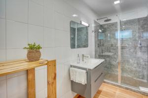 a bathroom with a sink and a shower at Quinta da Vila in Porto da Cruz