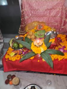 a cake with a flower on top of a table at Royal Rudraksh Palace in Bābatpur