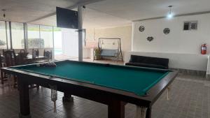 a living room with a pool table in a room at brisas del dique in San Fernando del Valle de Catamarca
