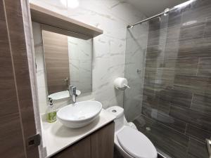 a bathroom with a sink and a toilet and a shower at Hotel Bello Horizonte in Santa Marta +61 photos