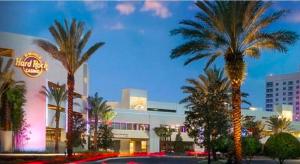 a group of palm trees in front of a building at The Monterey Beach Resort in St. Pete Beach