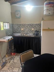 a kitchen with a sink and a counter top at Departamento Favaloro in RSA