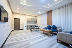 a living room with a couch and a table at Dar Hashim Serviced Apartments Al Morouj - Economic in Riyadh