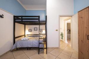 a bedroom with a bunk bed in a room at Relax House in Squinzano