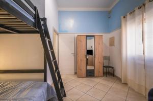 a room with a bunk bed and a door to a bedroom at Relax House in Squinzano +12 photos