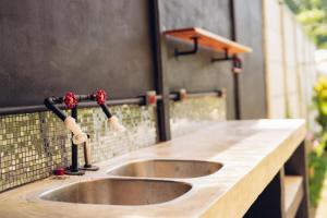 a sink in a counter top with a foss at Santa Toro Inn, private rooms close to the beach in Santa Teresa Beach +69 photos
