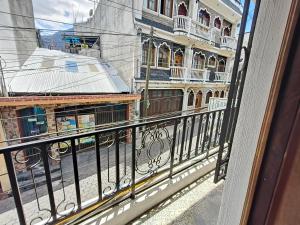 a view of a city from a balcony at Casas de Qlí in Santiago Atitlán
