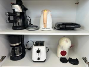 a shelf with a coffee maker and a blender at Sunny Private Beach in Balatonlelle