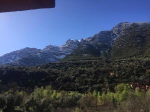 a mountain view with a house in the foreground at Chez Yahia, Au coeur de L'Ourika in Ourika