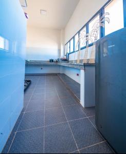 an empty room with a tile floor and a counter at Loft Beachfront Bungalow with Private Beach in Dakhla