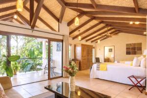 a bedroom in a villa with a bed at Buena Vista Chic Hotel in Alajuela
