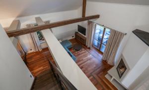 an overhead view of a living room with a staircase at The One Wadowice in Wadowice