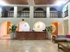 a lobby with a reception desk in a building at Solamar Inn Mazatlan in Mazatlán
