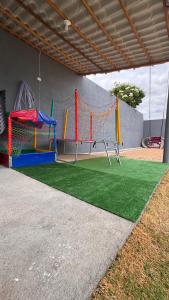 a play area with two swings at Chácara Santa Fé in Iguatu
