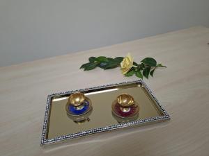 a plate with two bells on a table at Camera doppia in San Giuseppe Vesuviano