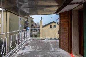 an open door to a balcony in a building at Villa jolly mini appartament in Marghera