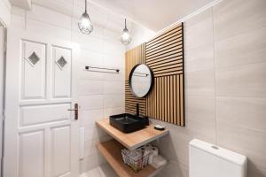 a bathroom with a mirror and a toilet at Mani Villa Ilias in Agios Nikolaos +54 photos