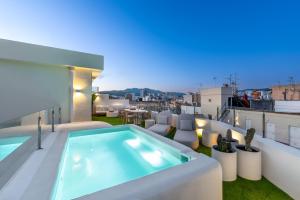 a swimming pool on the roof of a house at Ático 360º con Piscina in Málaga