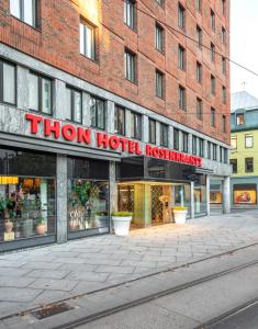a store front of a brick building with a sign that reads thor hotel notatown at Thon Hotel Rosenkrantz Oslo in Oslo