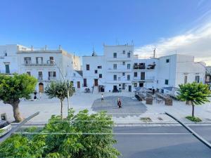 a group of white buildings in a city at L'Armonia - "La Terrazza" in Noci