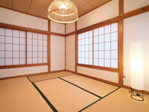 an empty room with a ping ping pong court at Kanigaya House in Kawasaki