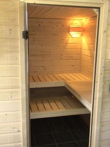 a wooden sauna with a light on top of it at Himmelblau in Dabitz