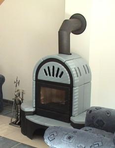 a stove sitting on the floor in a room at Himmelblau in Dabitz +3 photos