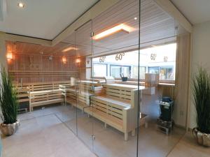 a synagogue with wooden benches and a glass wall at Ferienwohnung 210 Salinenparc Design Budget Hotel in Erwitte +13 photos
