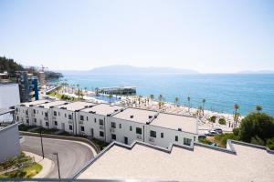 an aerial view of a building and the ocean at Babbo in Vlorë